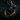 Goblin Gear Redline Compression Tee – man wearing a dark athletic shirt with a logo, sitting in a dark forest